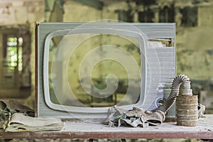 Broken TV and gas mask in Prypyat
