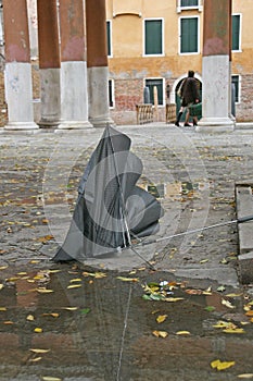 Broken umbrella in street of Venice