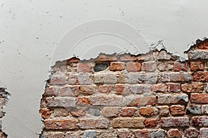 Broken wall with red brick