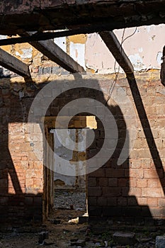 Broken walls, windows. The process of demolishing an old building. Demolition of dilapidated housing for new development