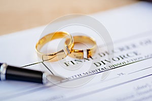 Broken wedding rings on divorce decree.