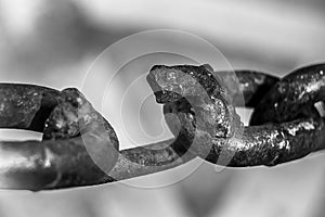 Broken and welded steel chain link, on white background