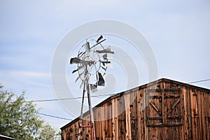 Broken windmill blades and barn in Terlingua Texas photo