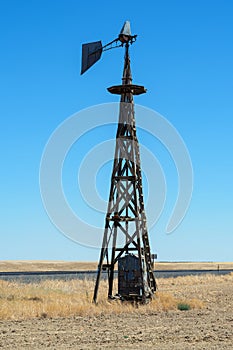 A broken windmill in a farm field near Lind, Washington, USA