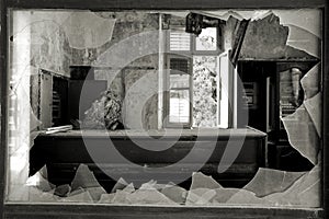 Broken window in an abandoned hotel