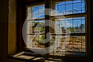 Broken window in abandoned house, HDR picture