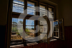 Broken window in abandoned house, HDR picture