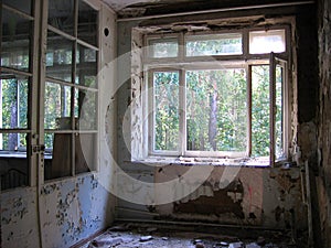 Broken window broken frame in a ruined house