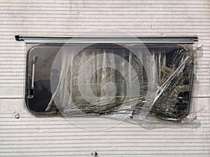 Broken window of a camper van