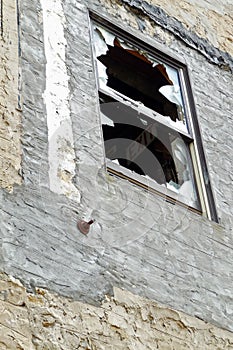 Broken window on derelict building