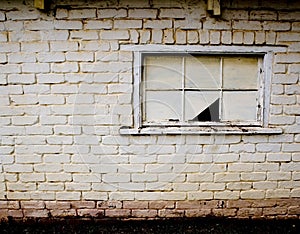 Broken window on derelict building