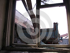 broken window broken frame in a ruined house