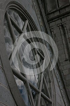 A broken window of a neo catolic church showing the star infamous from the second world war