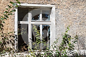 Broken window in an old abandoned house