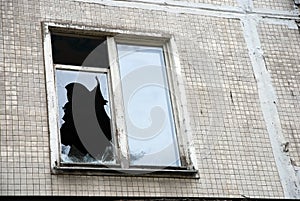 Broken window in old abandoned house