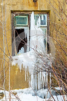 Broken window in an old house after fire