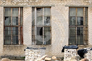 Broken windows in abandoned industrial building