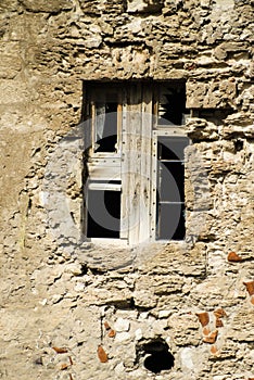 Broken Windows and stone wall