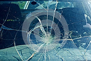 The broken windshield in the car accident photo