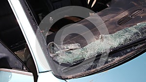 Broken windshield in a car after a collision with a pedestrian and a car accident. Road safety, car insurance