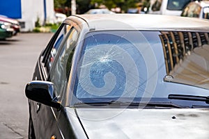 broken windshield of a car, cracks on the glass of a car, damaged glass