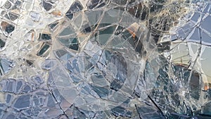 The broken windshield of the car. Glass splinter. An accident with the car. Dangerous traffic accident. Road accident. Glass