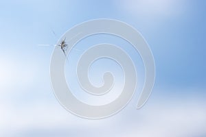 Broken windshield of a car. A web of radial splits, cracks on the triplex windshield. Broken car windshield.