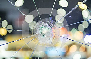 Broken windshield glass on a bokeh background