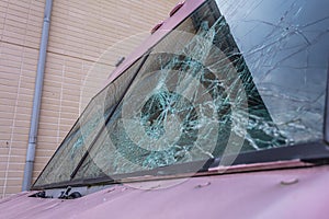 Broken windshield near the car. Machine repair concept.