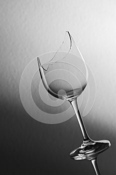 Broken wine glass slant on black white background