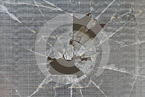 Broken wire mesh safety glass window