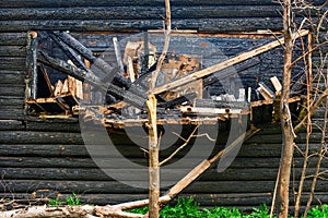 Broken wood on the background of the burnt down building