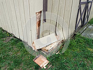 Broken wood storage shed structure with damage