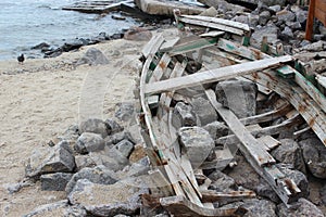 Broken wooden boat on the sea