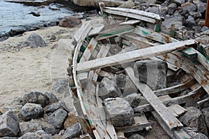 Broken wooden boat on the sea