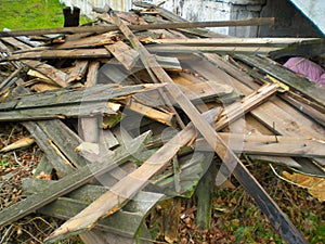 Broken wooden planks piled up on the floor