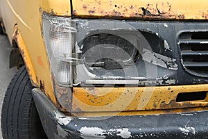 Broken yellow car. The van crashed. close-up