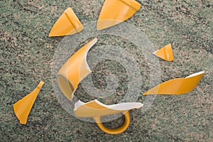 Broken yellow cup