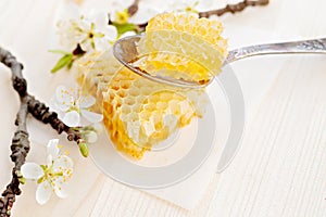 Broken yellow honeycomb with honey on table. Honey products. healthy natural food concept