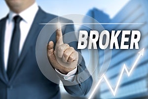 Broker touchscreen is operated by businessman