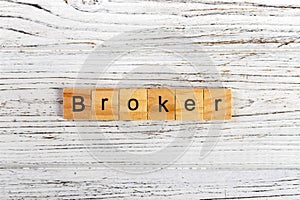 BROKER word made with wooden blocks concept
