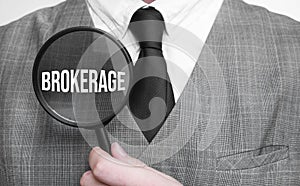 brokerage. Education concept. Businessman hands with magnifier