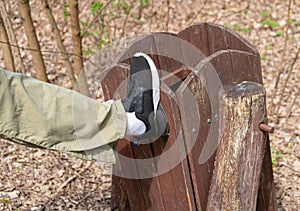 Broking Trash Bin by Vandal, Damaging Wooden Trash Can