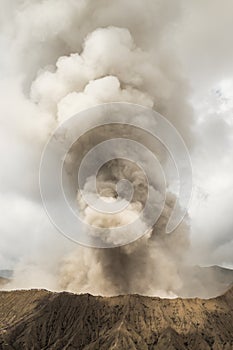 Bromo eruption releasing smoke, steam and ashes