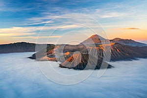 Bromo volcano mountain at sunrise in East Java, Indonesia surrounded by morning fog