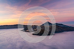 Bromo volcano mountain at sunrise in East Java, Indonesia surrounded by morning fog