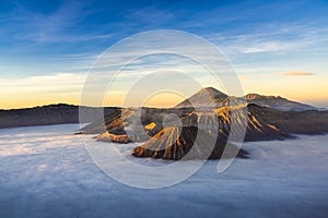 Bromo volcano mountaion at sunrise in East Java, Indonesia surrounded by morning fog