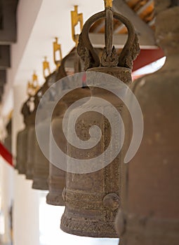 Bronse bells in the garden of Royal monastery Wat Chuai Mongkong (Pattaya, Thailand)