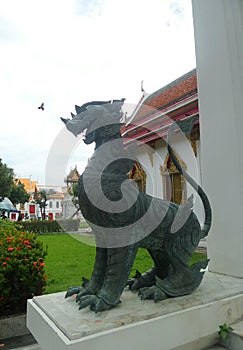 Bronz singha guarding the Marble temple entrance