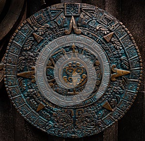Bronze ancient antique classical Aztec calendar round ornament pattern decoration design background. Aztec abstract texture fracta photo